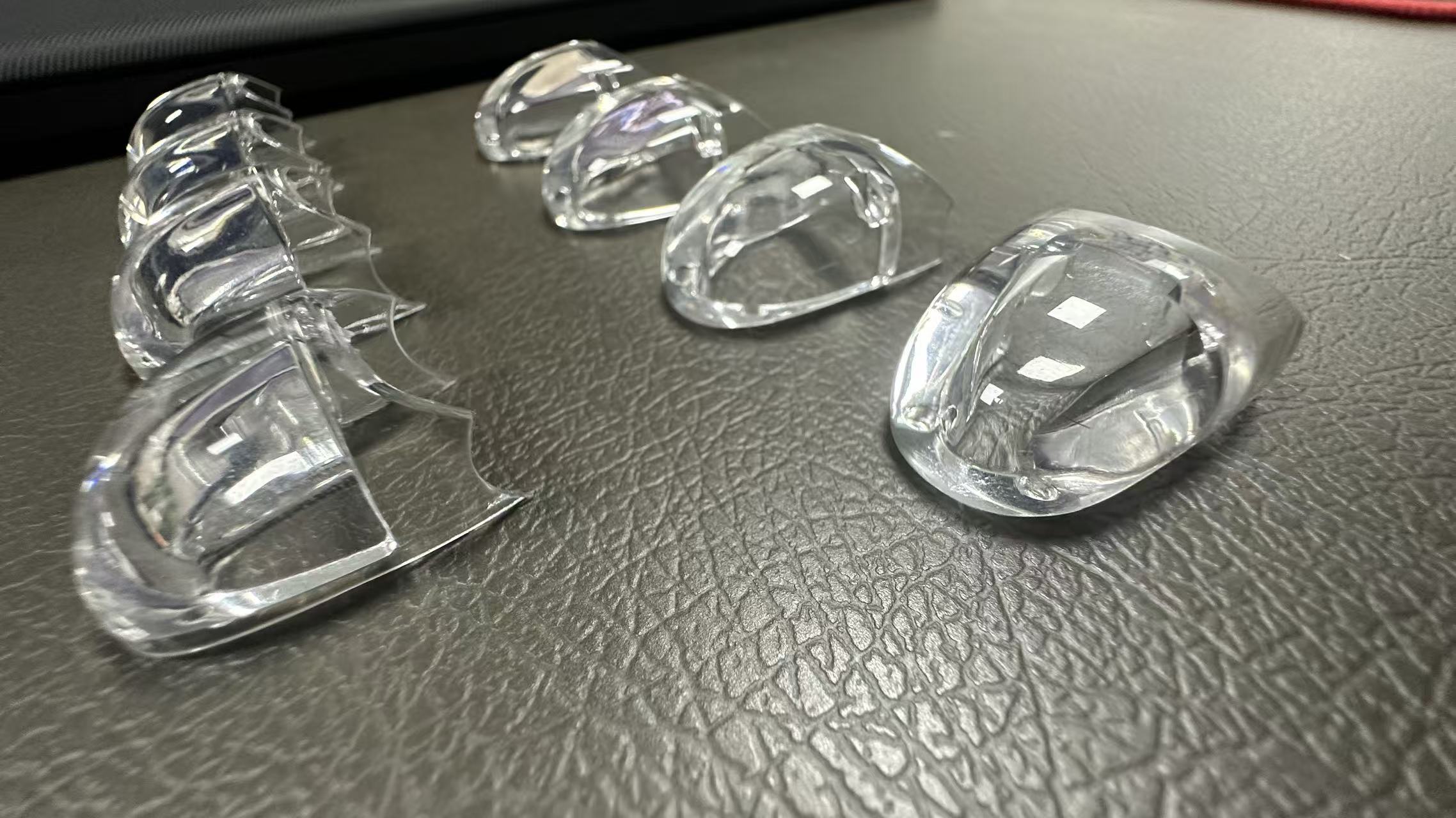 User-supplied photograph of transparent LSR-overmolded PC finger-joint samples