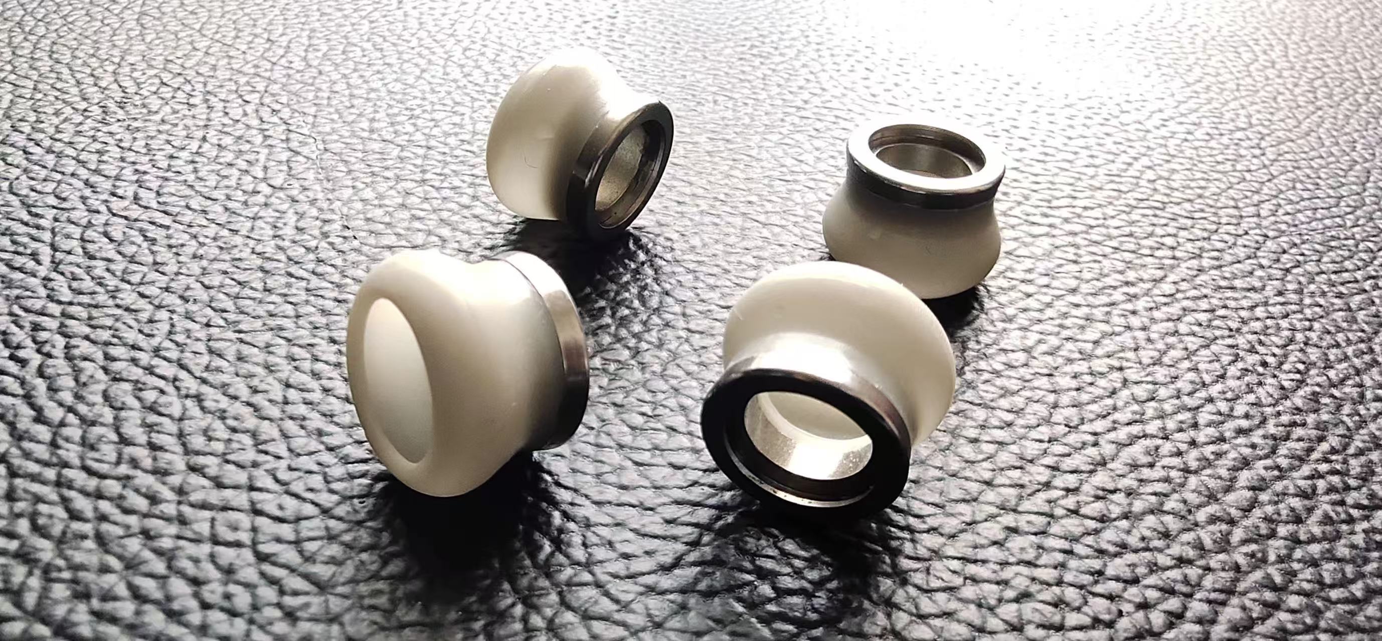 Four 316L stainless-steel inserts overmolded with translucent LSR for a nasal plug component project