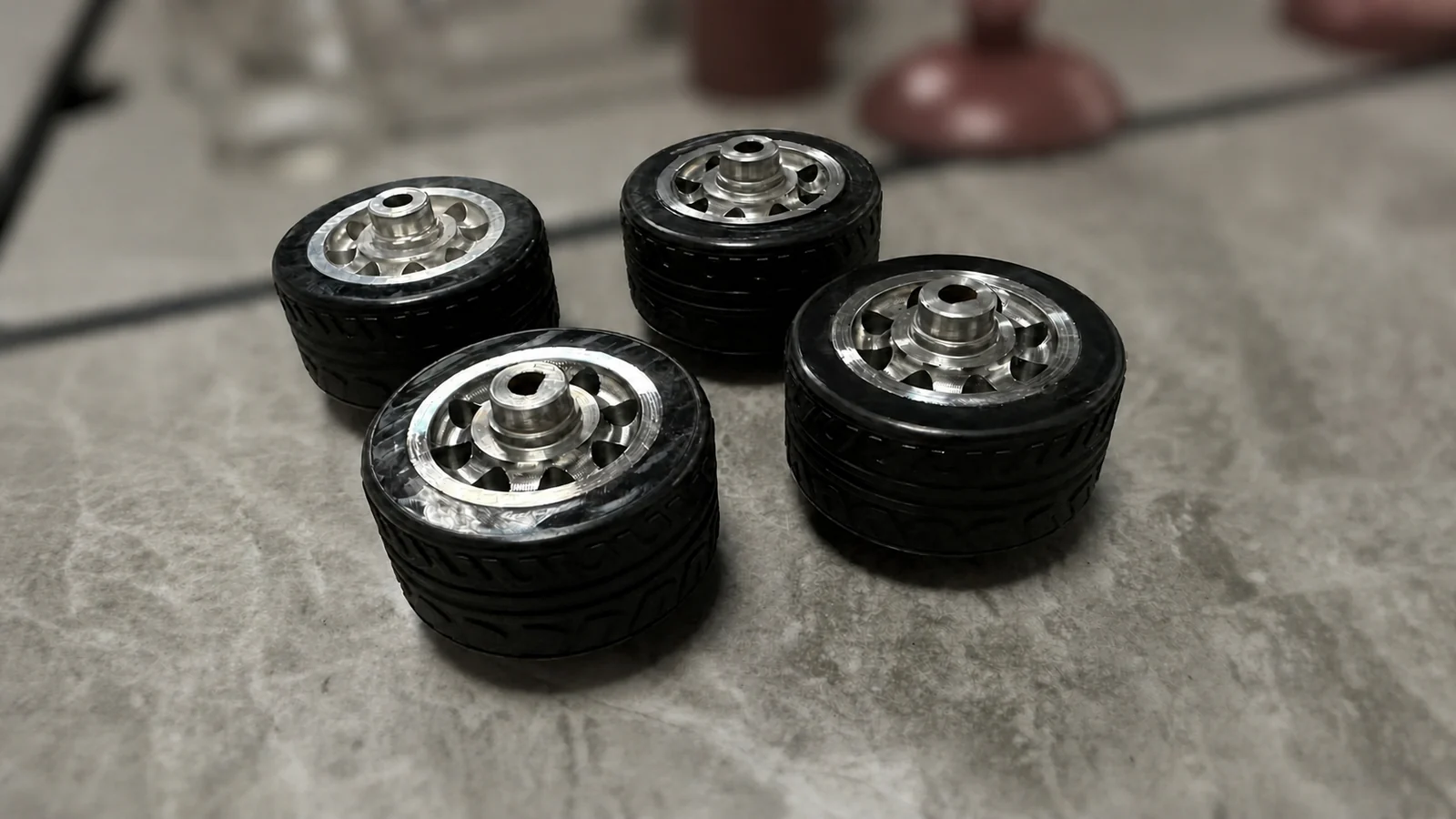 Machined aluminum-core rubber wheel samples for a robot project